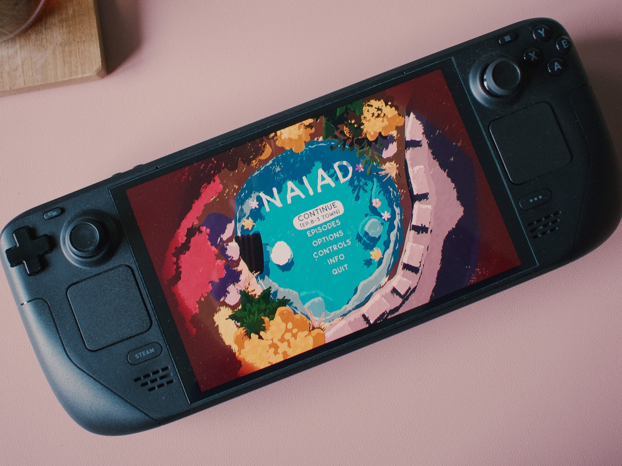 Picture of a steam deck featuring the game NAIAD